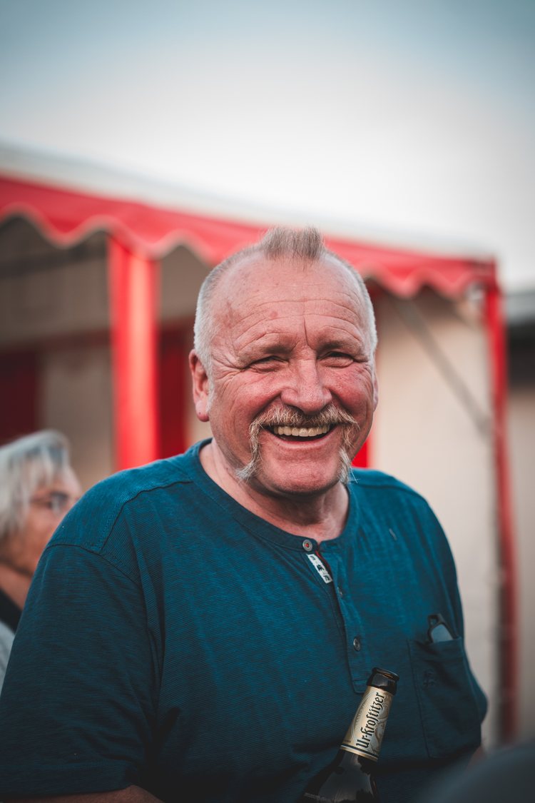A laughing guest at a local gathering.